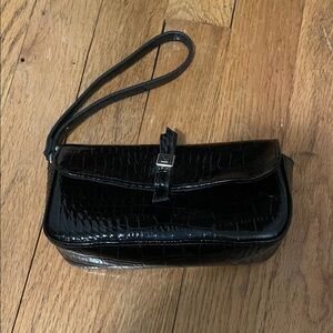 Liz Claiborne crocodile black wristlet.